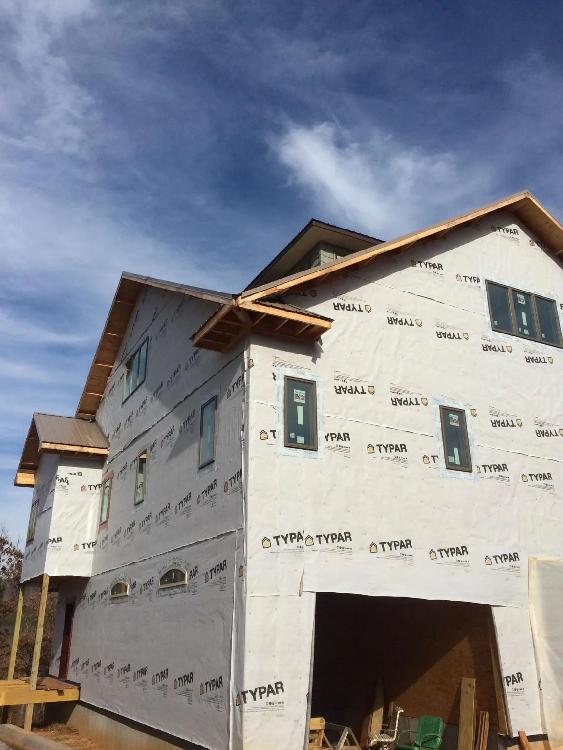 Stick built house wrapped in Typar with new roof framing and dormers in Underwood
